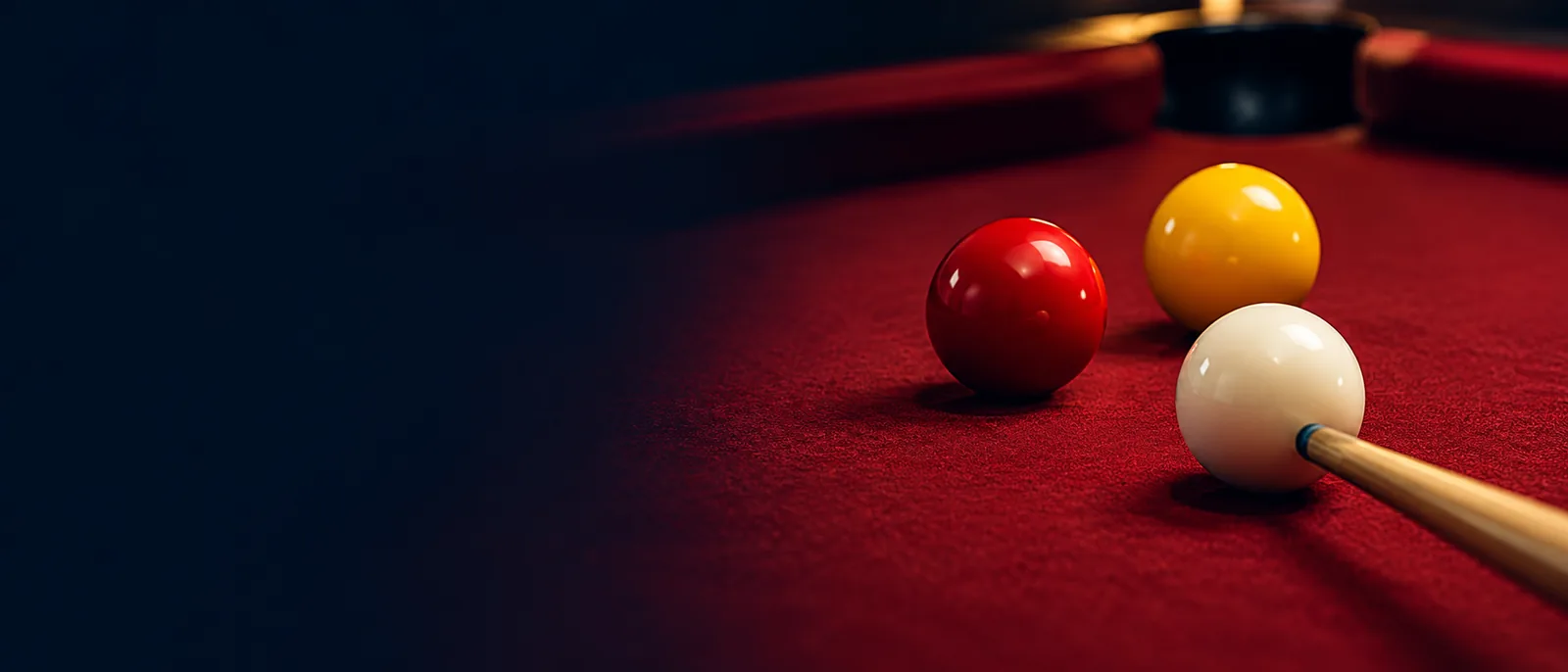 Illustrative plain red and yellow pool balls and a white cue ball; not the actual venue